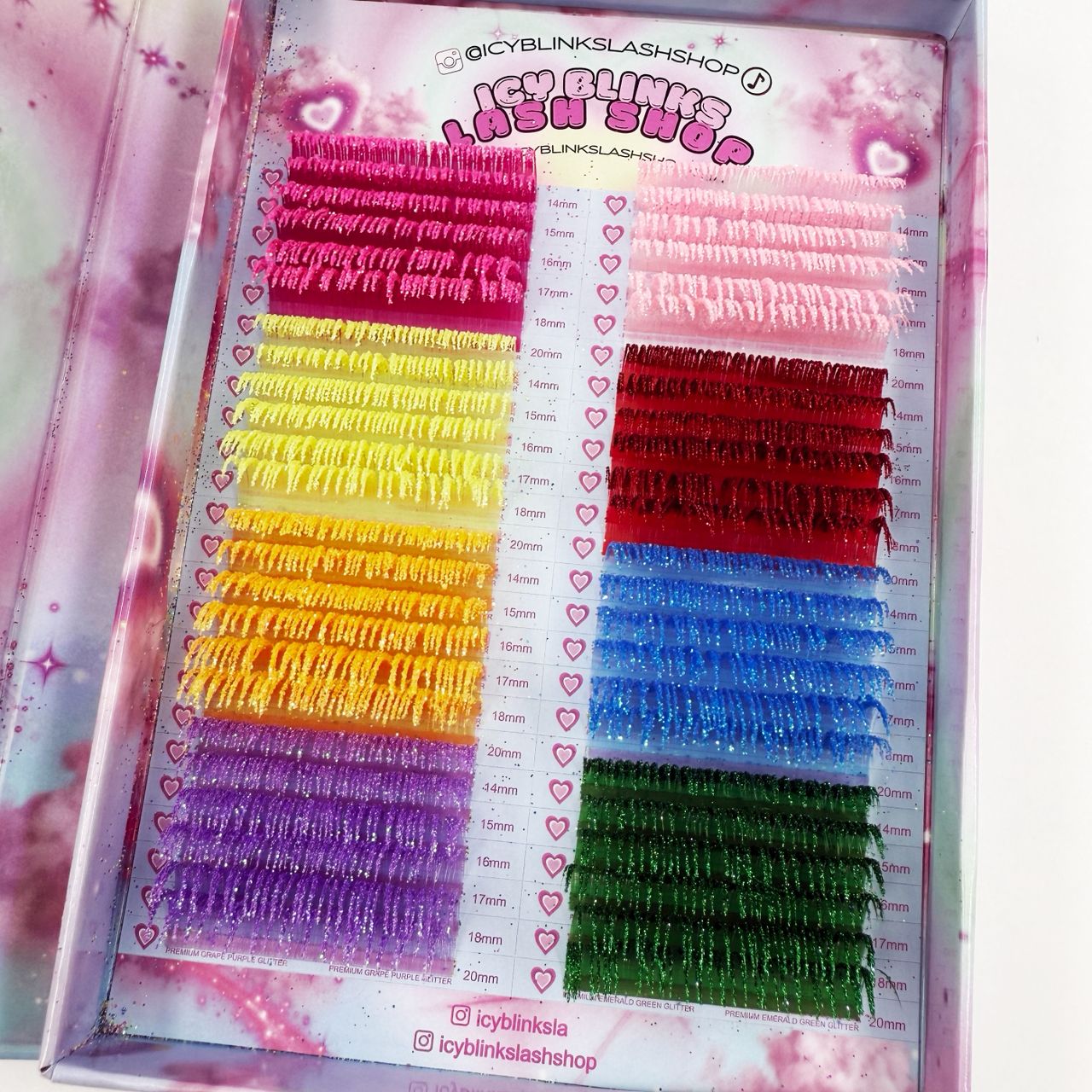 Eyelash extension set with color swatches on a pink background

